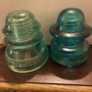 Vintage glass insulators in good condition.